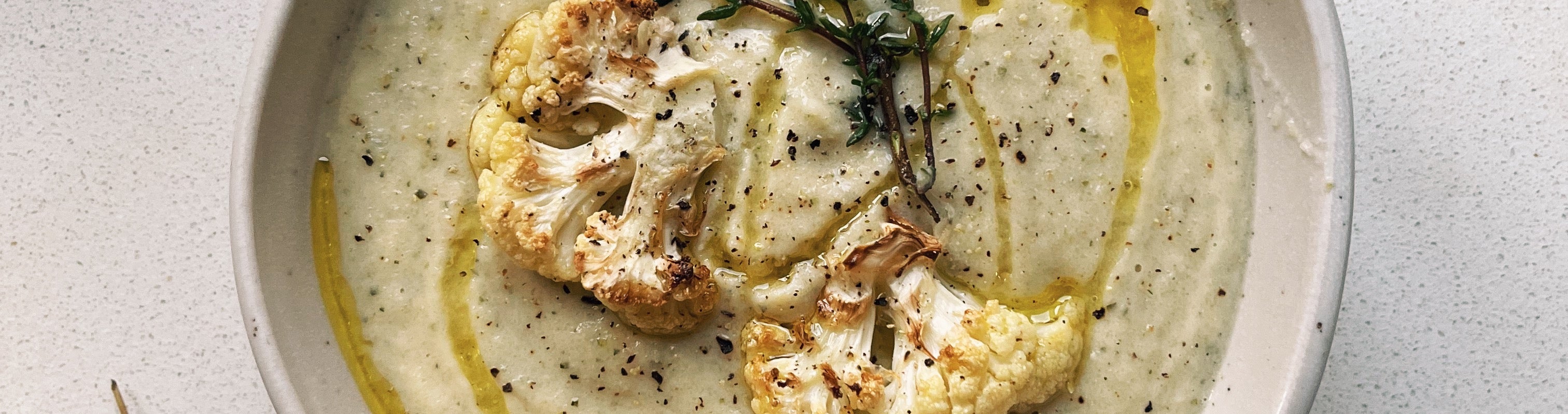 Roasted cauliflower soup with thyme and extra virgin olive oil