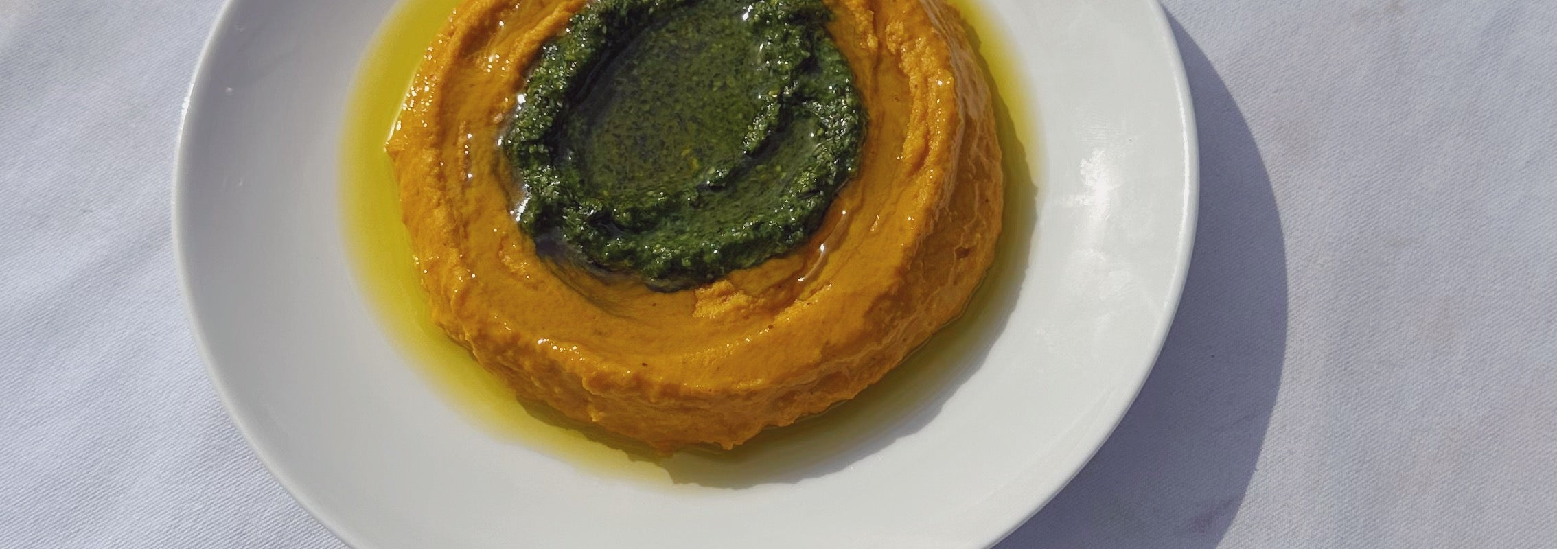 Image for Zero waste carrot hummus: Carrot tops, nuts, fragrant herbs, and a good pour of Citizens of Soil olive oil com