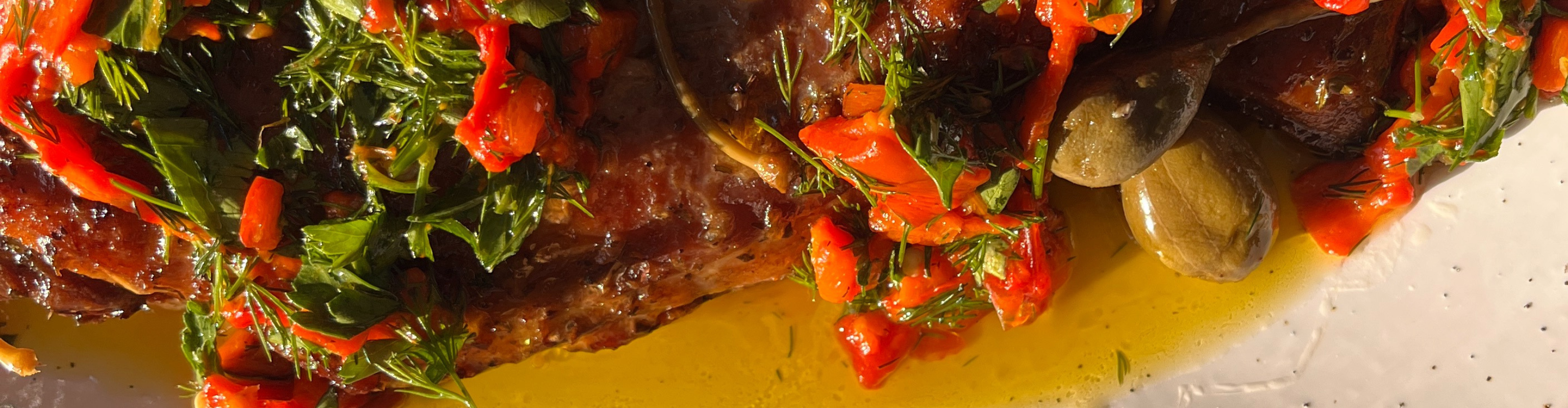 Image for Slow-cooked lamb with red pepper salsa: In Greece, it's traditional to break the Lent fast on Easter Sunday by